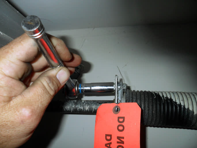 adjust garage door spring