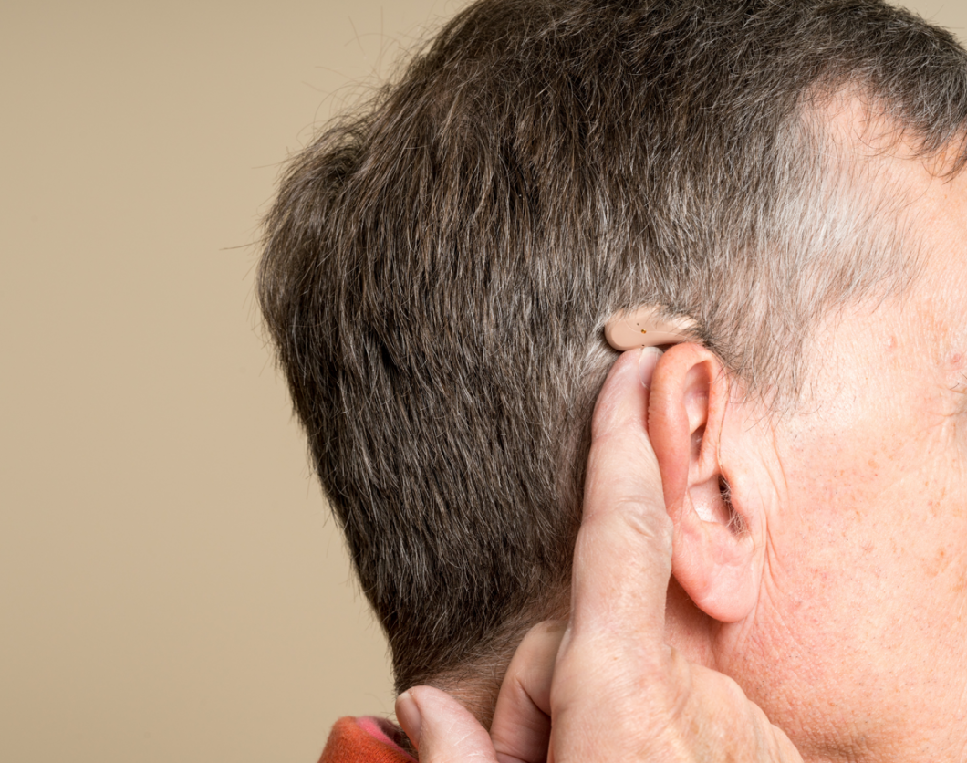 Hearing aids in someone's ear