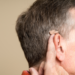 Hearing aids in someone's ear
